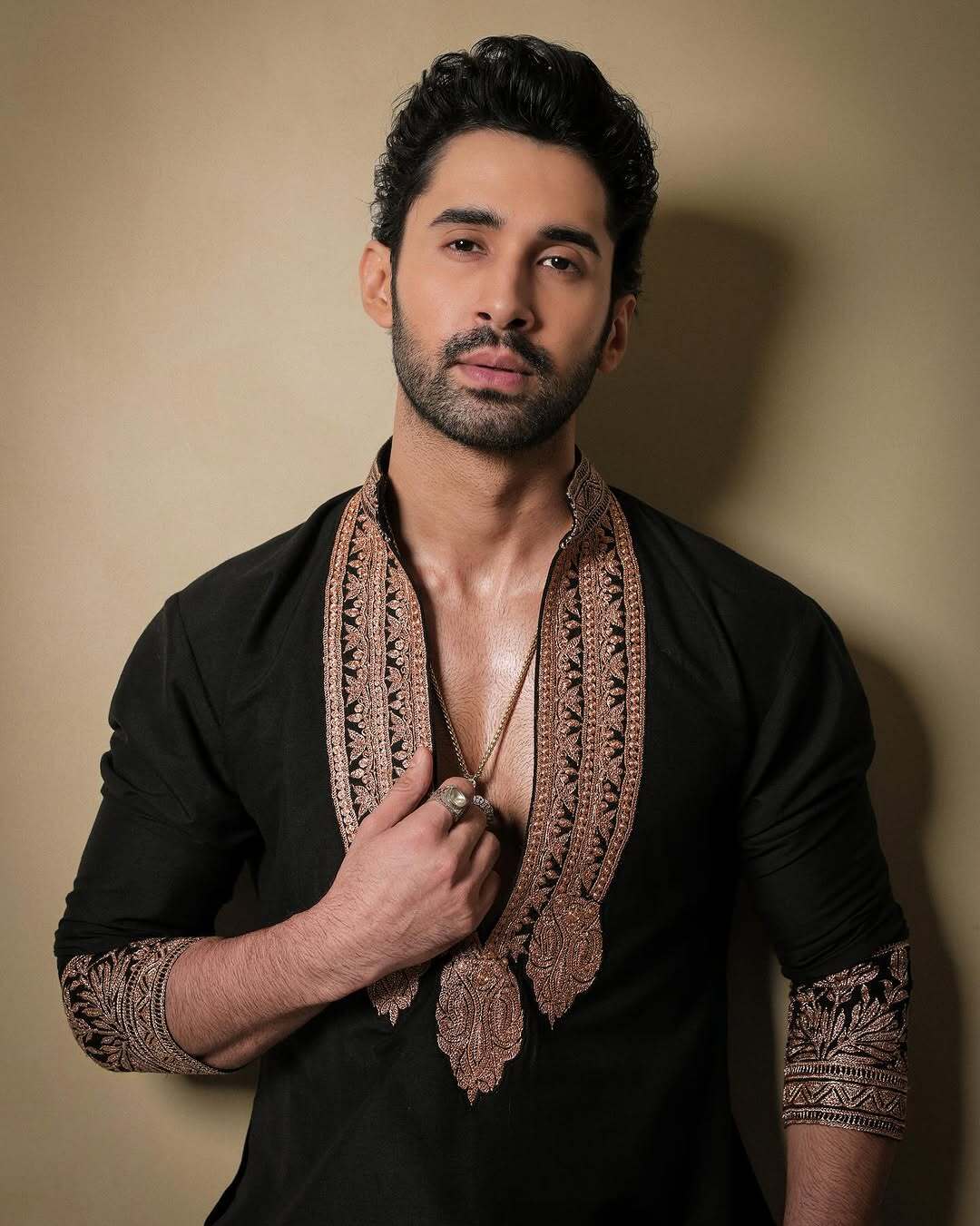 Black & Gold Celebrities Tilla Placket Kurta Pajama Set by designer Manish Malhotra