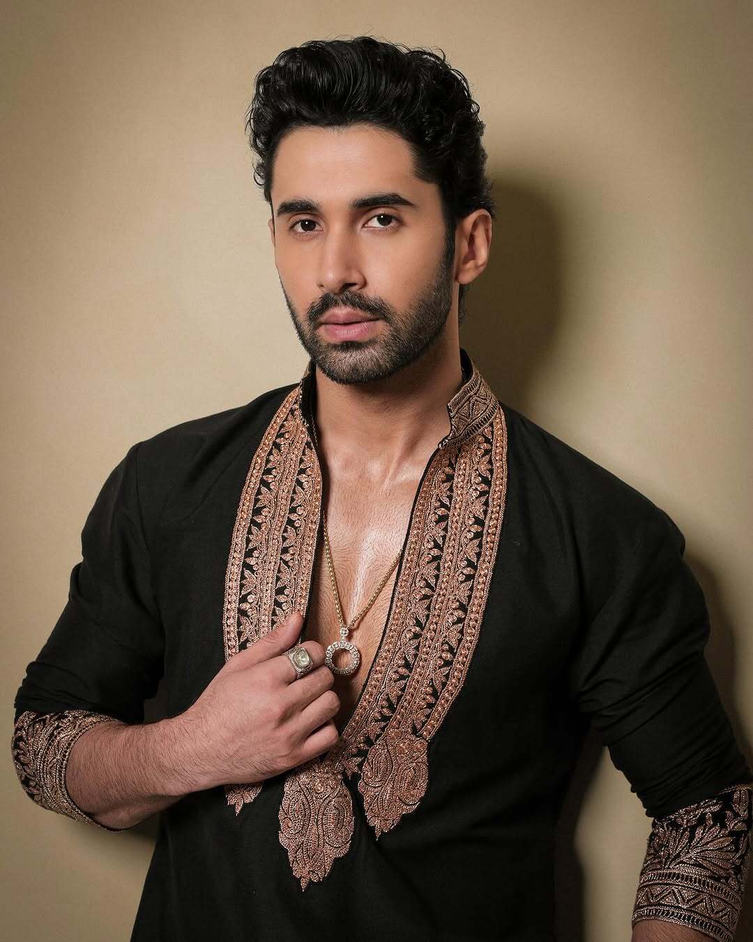 Black & Gold Celebrities Tilla Placket Kurta Pajama Set by designer Manish Malhotra