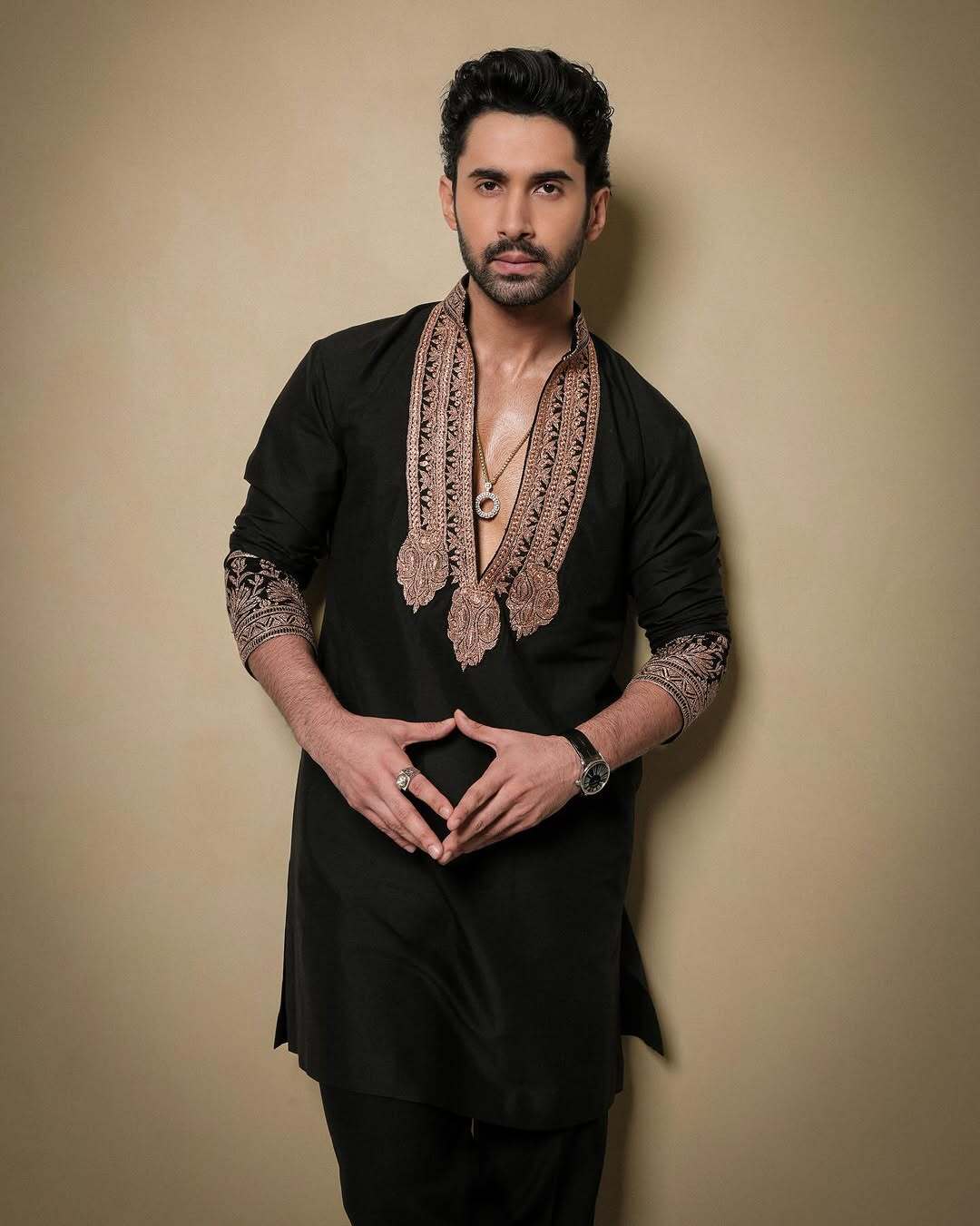 Black & Gold Celebrities Tilla Placket Kurta Pajama Set by designer Manish Malhotra
