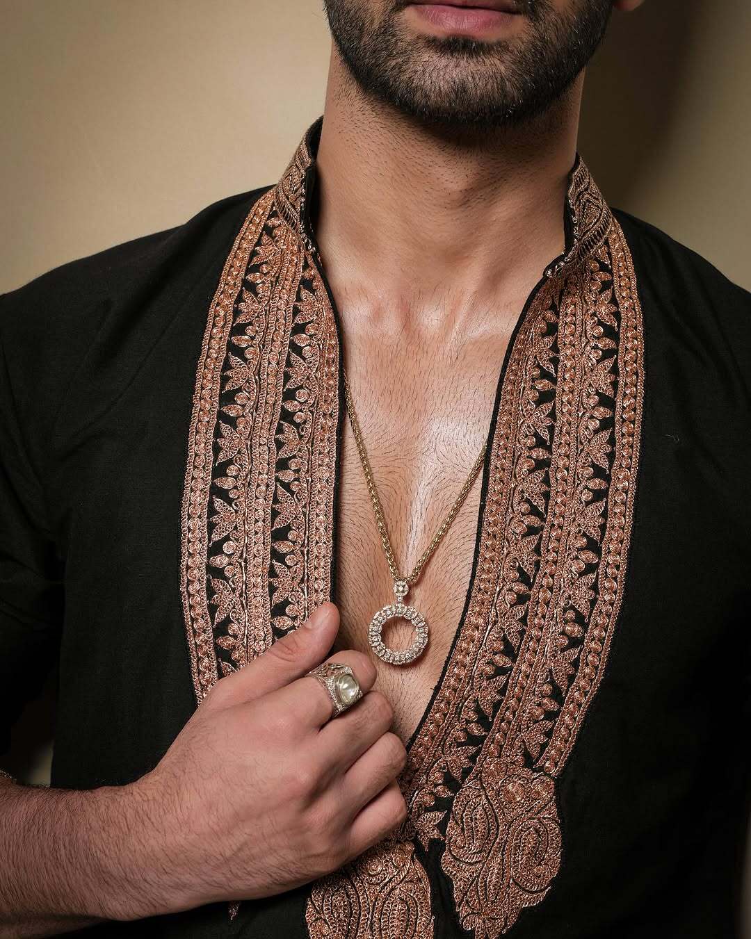 Black & Gold Celebrities Tilla Placket Kurta Pajama Set by designer Manish Malhotra