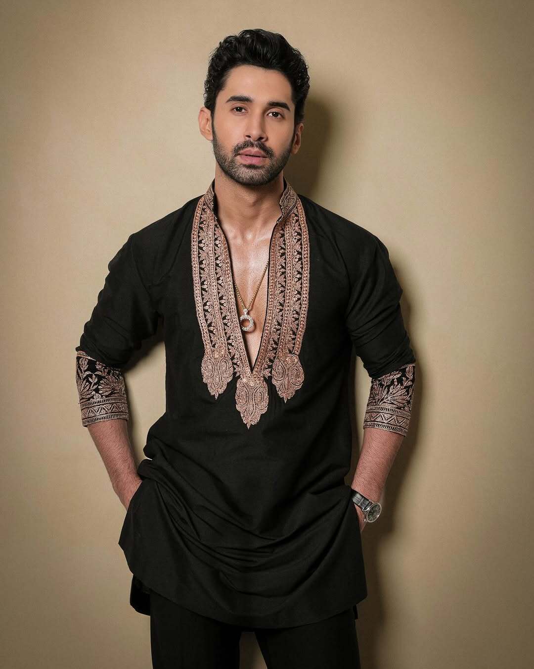 Black & Gold Celebrities Tilla Placket Kurta Pajama Set by designer Manish Malhotra